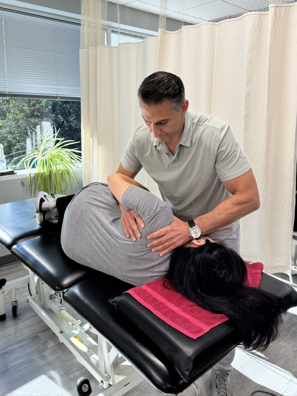 Physiotherapist assisting a patient