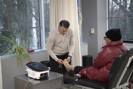 Dr. Rob Letizia assessing a patient's big toe and forefoot after bunion surgery at Spectrum Therapeutics in Wayne, NJ.