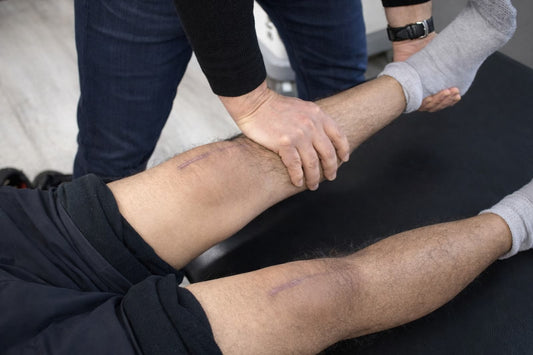 Hands-on assessment of the calf and lower leg of a post-surgical knee at Spectrum Therapeutics in Wayne, NJ.