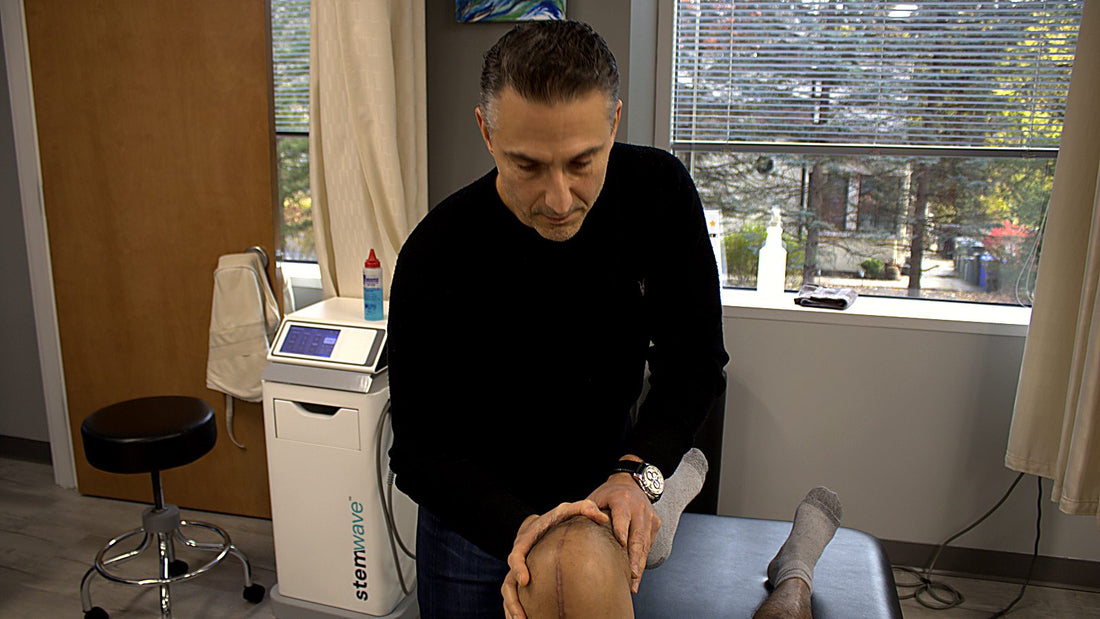 Dr. Rob Letizia assessing knee flexion range of motion on a post-surgical total knee replacement patient in Wayne, NJ