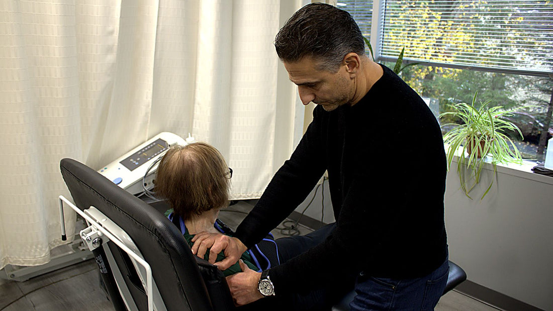 Dr. Rob Letizia performing hands-on cervical neck manual therapy on a patient in Wayne, NJ