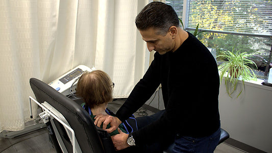 Dr. Rob Letizia performing hands-on cervical neck manual therapy on a patient in Wayne, NJ