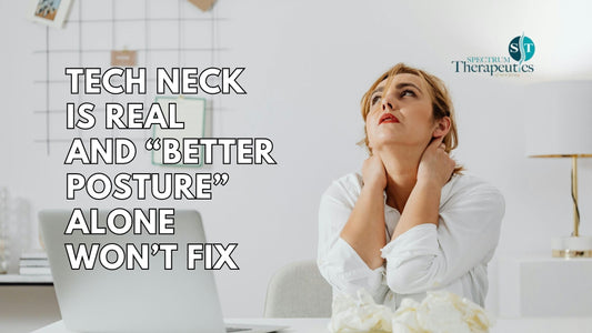 Person at desk experiencing tech neck with neck and upper back discomfort