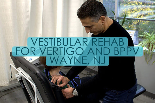 Dr. Rob Letizia, PT, DPT performing hands-on manual therapy on a seated patient at Spectrum Therapeutics in Wayne, NJ, titled “Vestibular Rehab For Vertigo And BPPV Wayne, NJ”